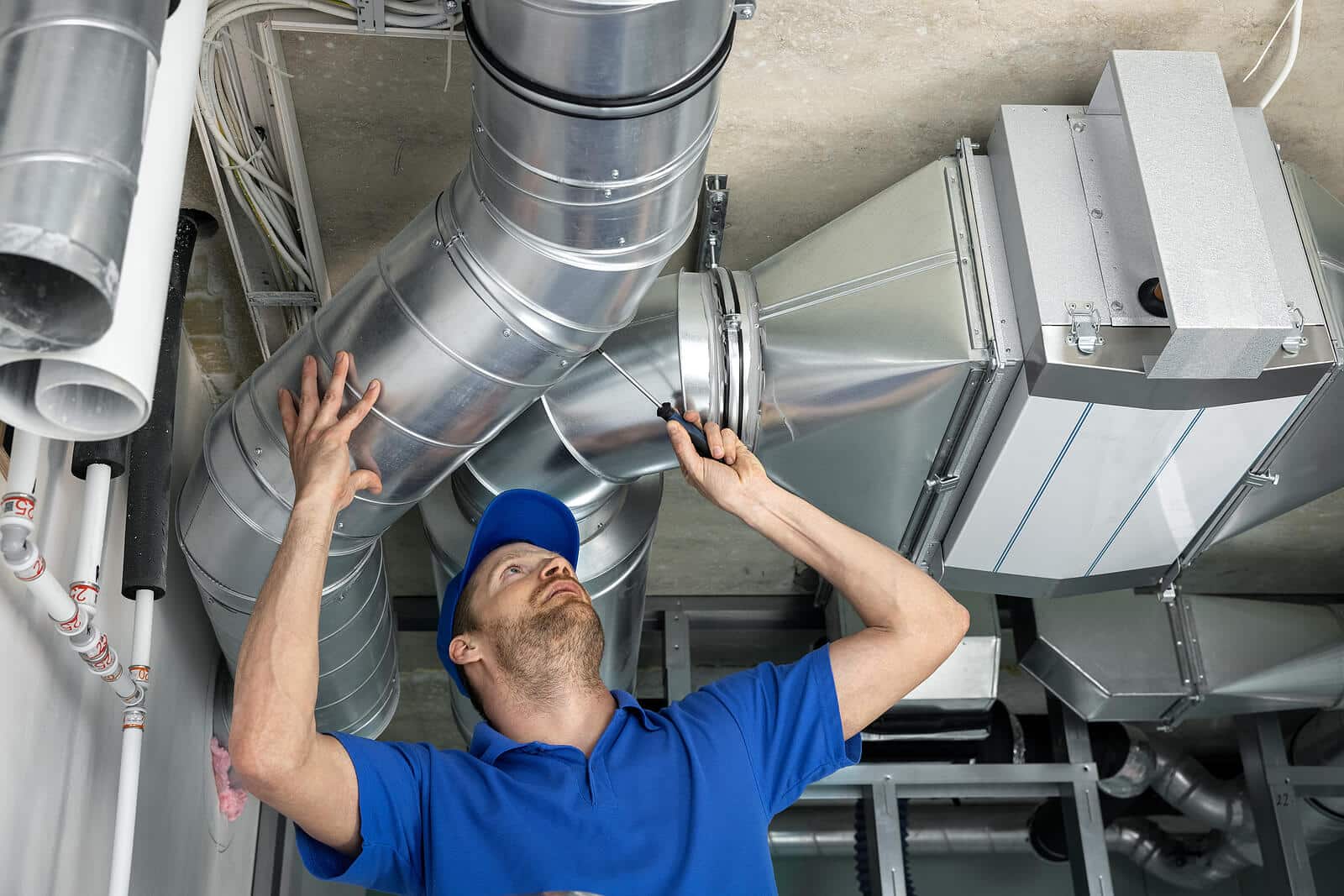 HVAC technician inspecting and repairing air ducts in Granite Bay