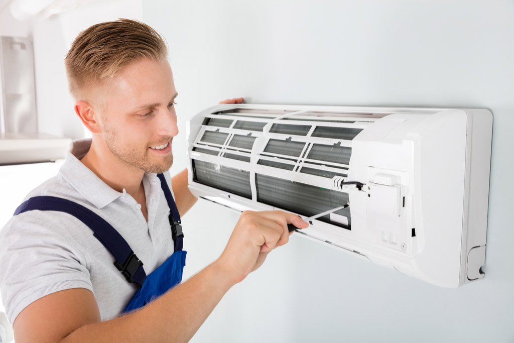 HVAC technician maintaining a ductless air conditioner in Granite Bay