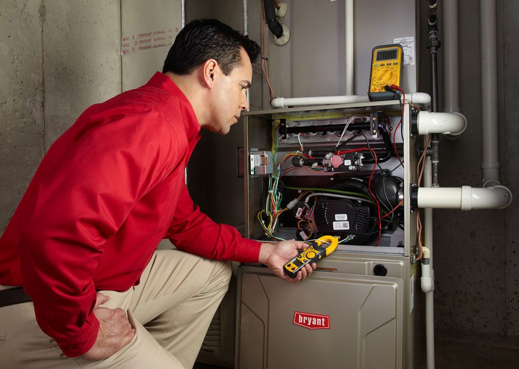 Heating technician diagnosing a furnace repair in Granite Bay