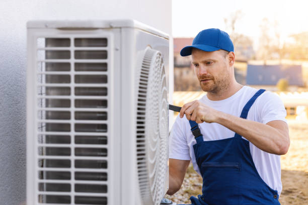 HVAC technician servicing an outdoor air conditioner in Granite Bay
