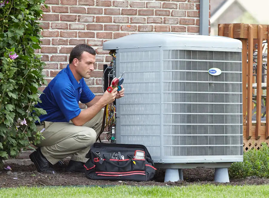 HVAC technician inspecting an outdoor AC unit in Granite Bay