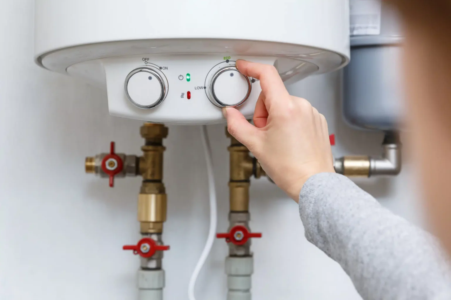 Technician adjusting a water heater in Granite Bay